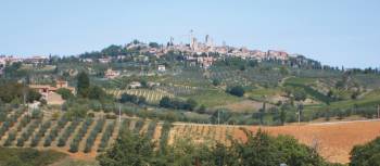 Classic Tuscan countryside with the towers of San Gimignano in the distance | Chris Viney